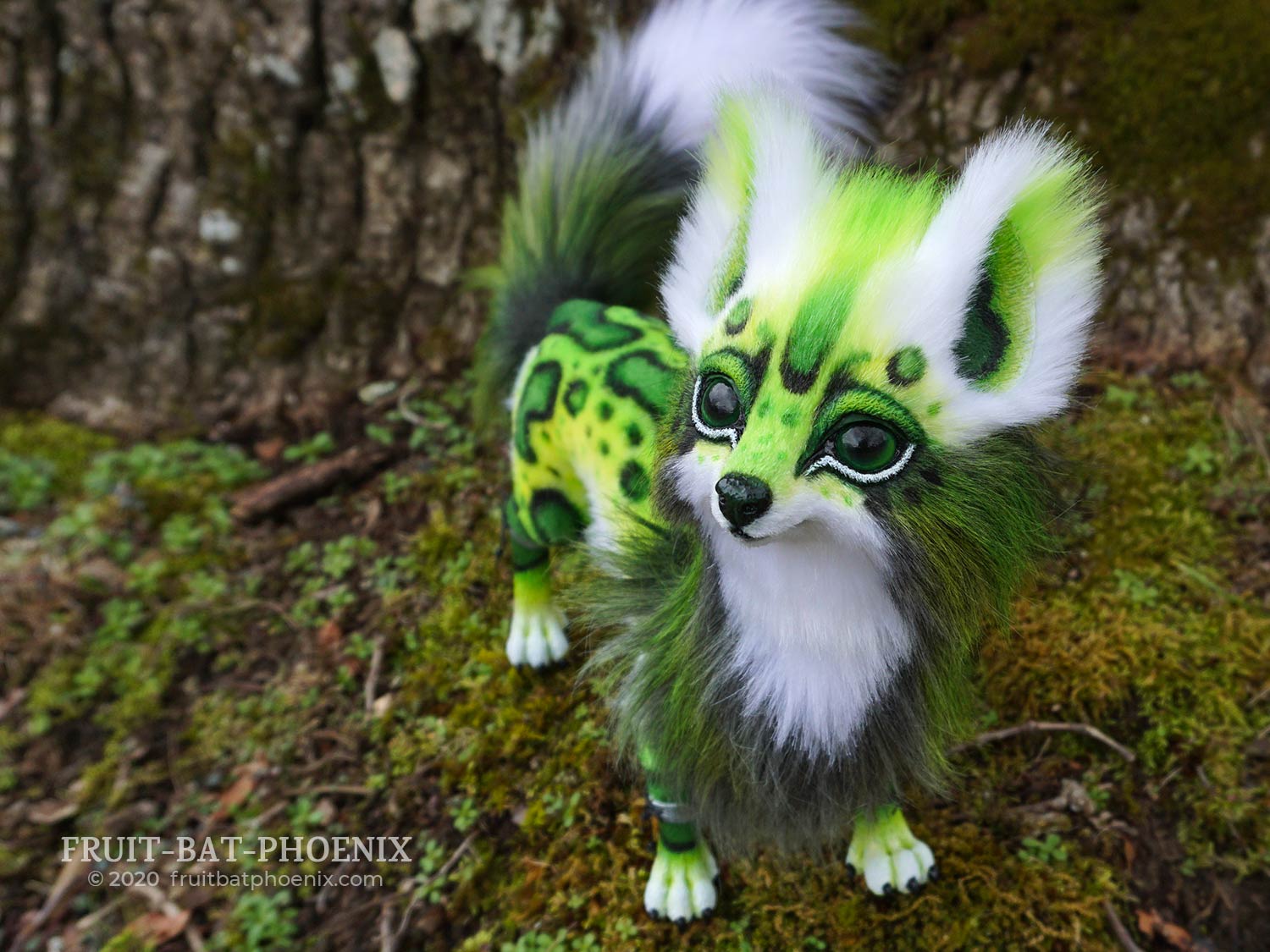 Chlorophyll green fox posable art doll looks up cutely.