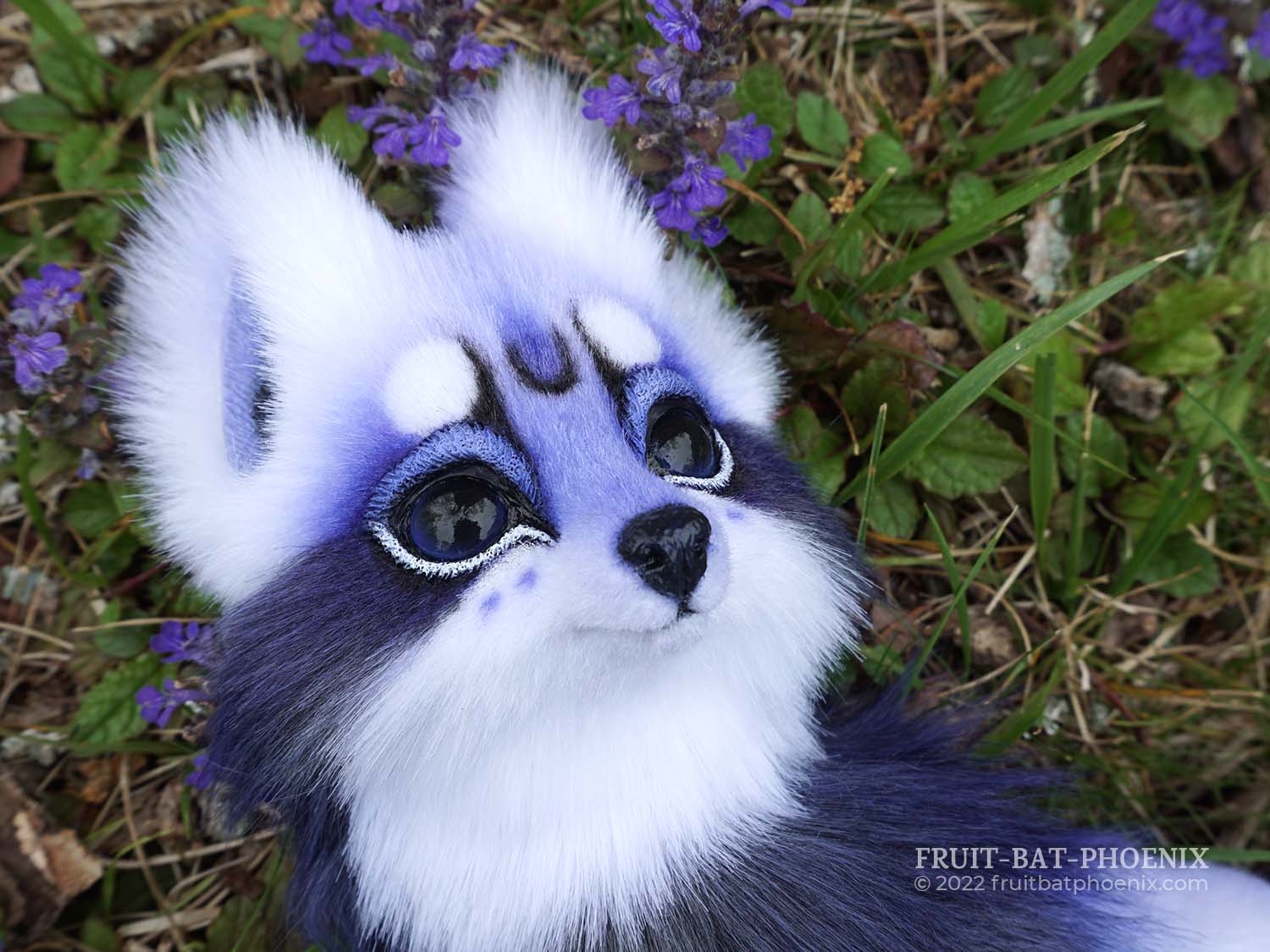 headshot of a realistic cute lavender, white, and grey fox art doll